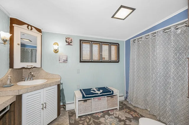 a bathroom with a sink a mirror and a toilet