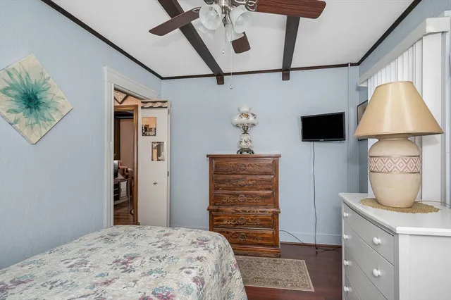 a bedroom with a bed and a dresser