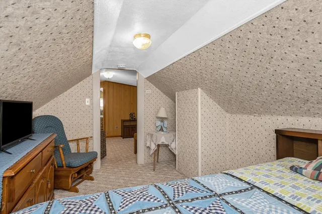 a bedroom with a bed and furniture