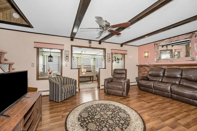 a living room with furniture and a rug