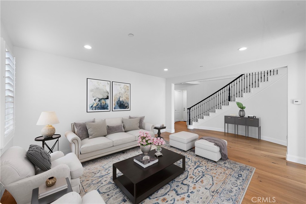 8 Kane Lane Ladera Ranch, CA 92694 - Photo 12 of 49 a living room with furniture and wooden floor