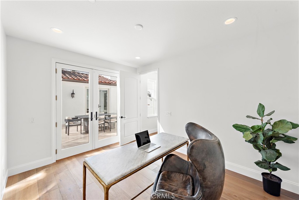 8 Kane Lane Ladera Ranch, CA 92694 - Photo 15 of 49 a workspace with furniture and wooden floor