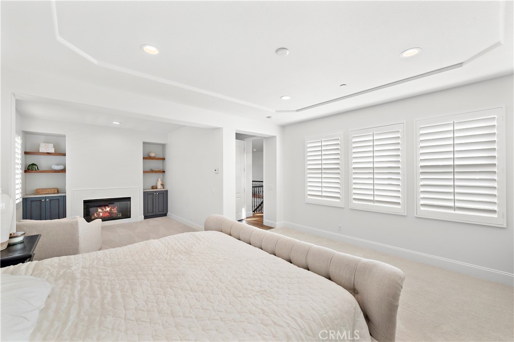 8 Kane Lane Ladera Ranch, CA 92694 - Photo 17 of 49 a bedroom with a large bed and a large window