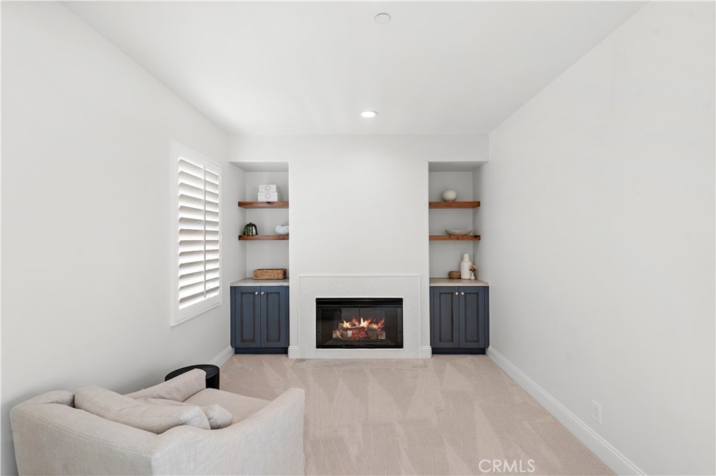 8 Kane Lane Ladera Ranch, CA 92694 - Photo 18 of 49 a view of an empty room with a fireplace and window