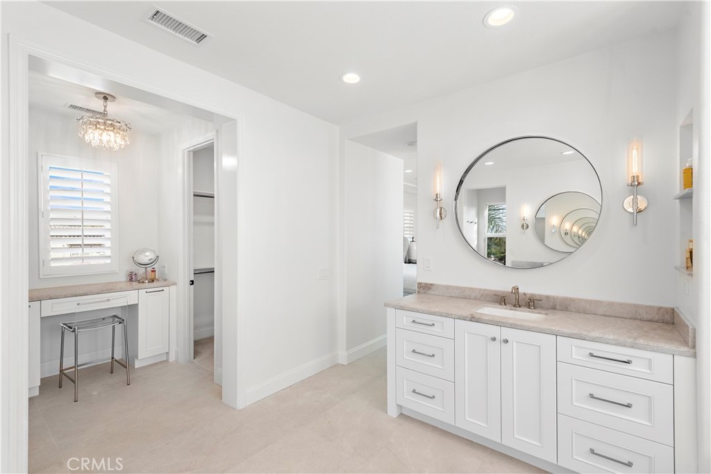 8 Kane Lane Ladera Ranch, CA 92694 - Photo 21 of 49 a spacious bathroom with a granite countertop sink a mirror and a vanity