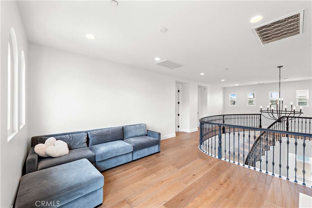 8 Kane Lane Ladera Ranch, CA 92694 - Photo 23 of 49 a living room with furniture and a wooden floor