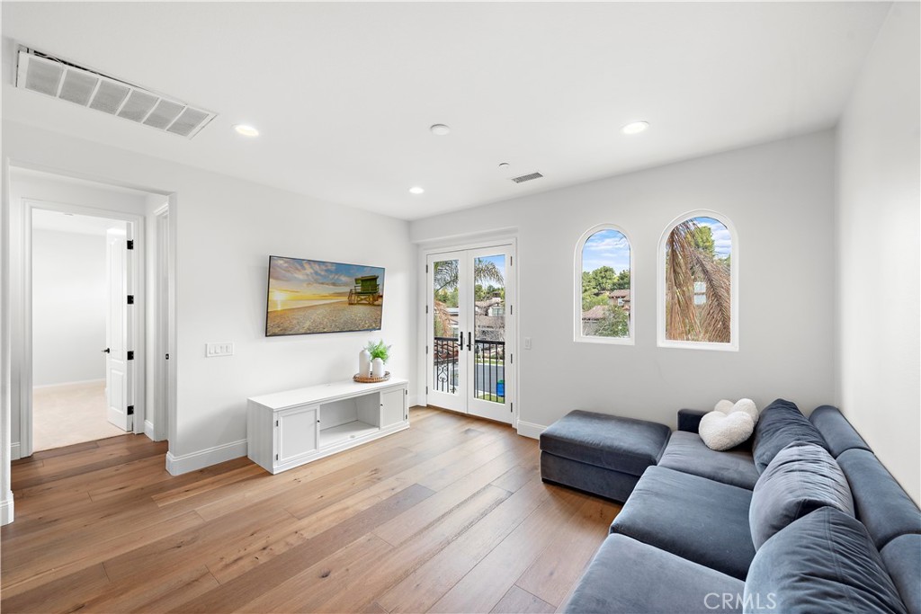 8 Kane Lane Ladera Ranch, CA 92694 - Photo 24 of 49 a living room with furniture and wooden floor