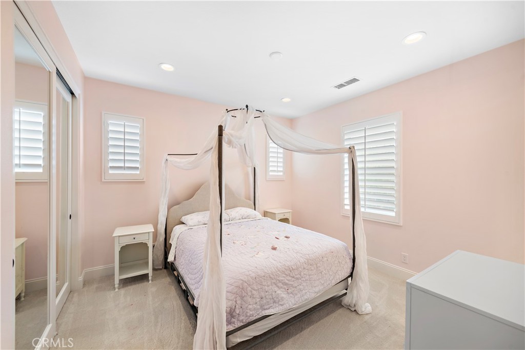 8 Kane Lane Ladera Ranch, CA 92694 - Photo 25 of 49 a bedroom with a bed and a table