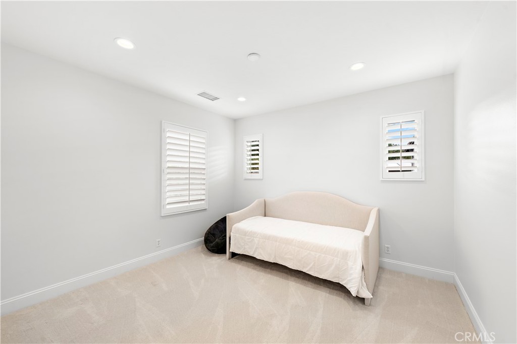 8 Kane Lane Ladera Ranch, CA 92694 - Photo 27 of 49 a spacious bedroom with a bed and a couch