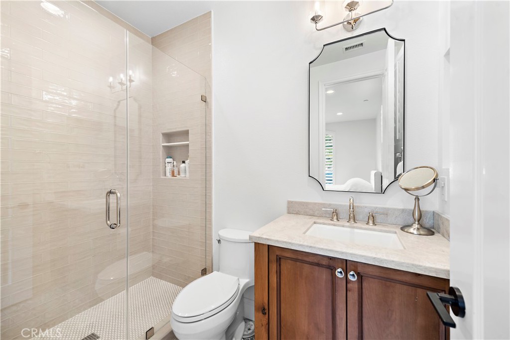 8 Kane Lane Ladera Ranch, CA 92694 - Photo 32 of 49 a bathroom with a sink a toilet and shower