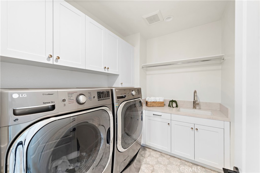 8 Kane Lane Ladera Ranch, CA 92694 - Photo 33 of 49 a utility room with sink dryer and washer