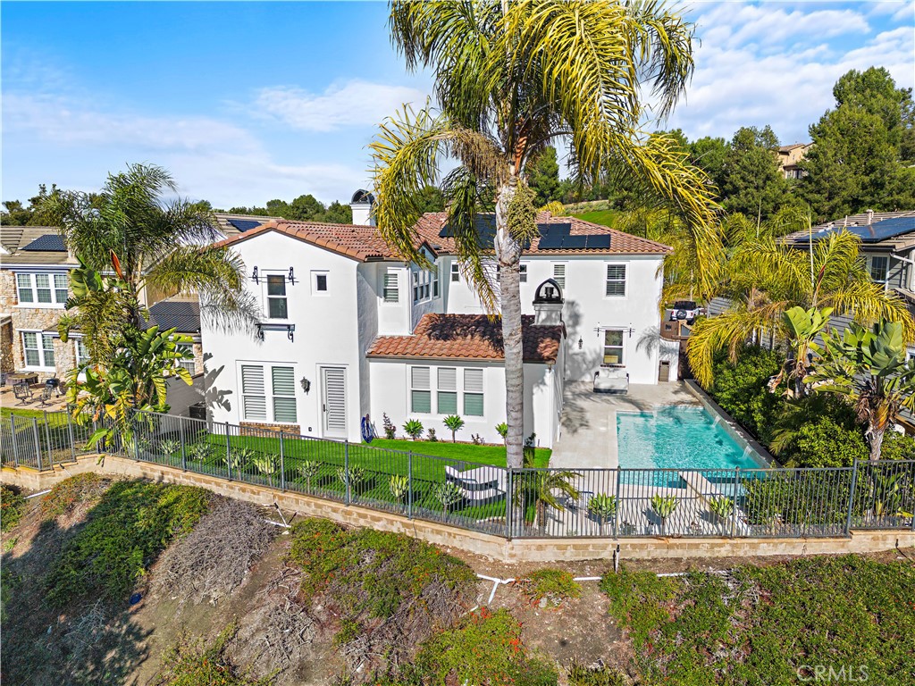 8 Kane Lane Ladera Ranch, CA 92694 - Photo 37 of 49 a front view of a house with a yard and potted plants