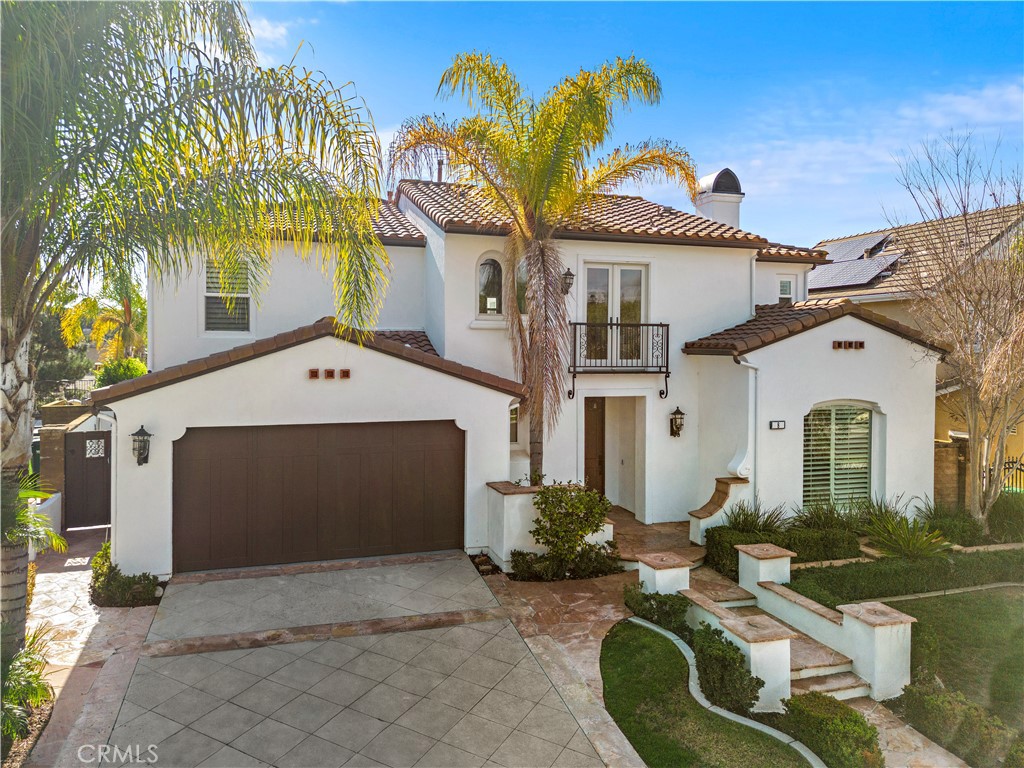 8 Kane Lane Ladera Ranch, CA 92694 - Photo 38 of 49 a front view of a house with a yard and garage