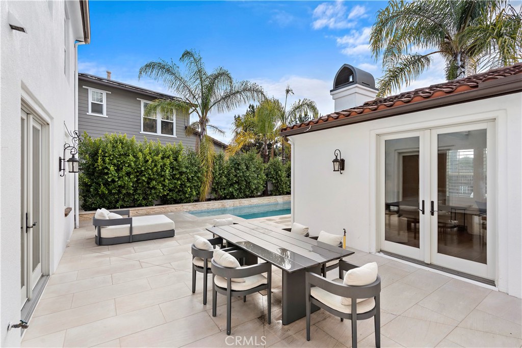 8 Kane Lane Ladera Ranch, CA 92694 - Photo 48 of 49 a view of a patio with a table and chairs and potted plants