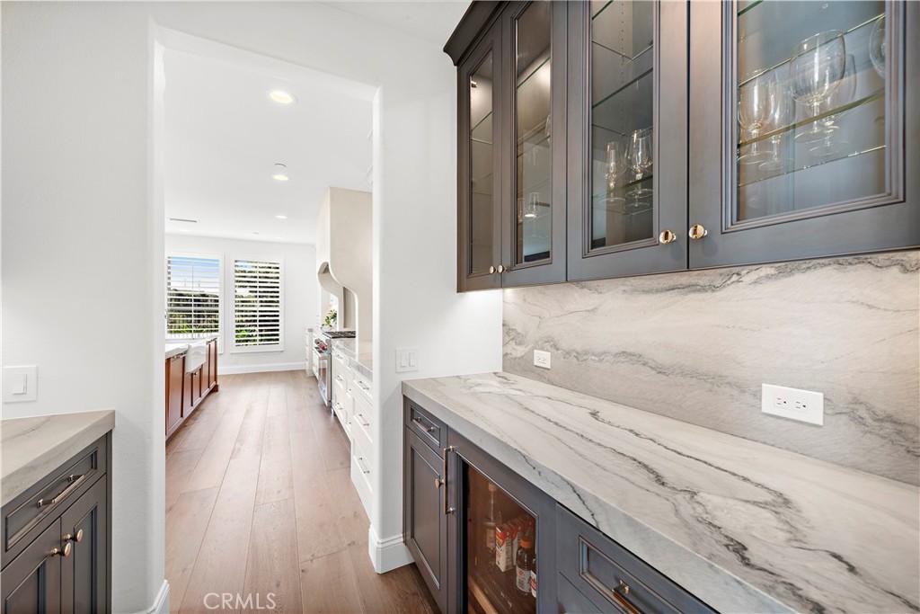 8 Kane Lane Ladera Ranch, CA 92694 - Photo 7 of 49 a view of a kitchen cabinets a sink and wooden floor