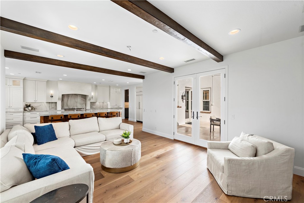 8 Kane Lane Ladera Ranch, CA 92694 - Photo 9 of 49 a living room with furniture and wooden floor