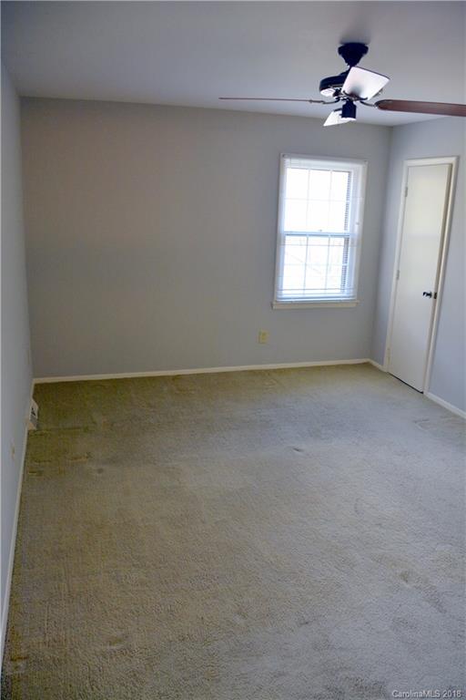 8700 Houston Ridge Road Charlotte, NC 28277 - Photo 14 of 22 an empty room with a window and a ceiling fan