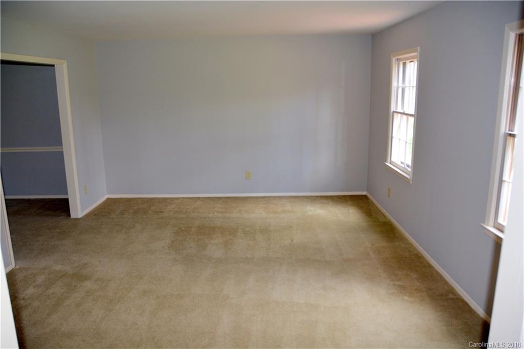 8700 Houston Ridge Road Charlotte, NC 28277 - Photo 6 of 22 an empty room with windows