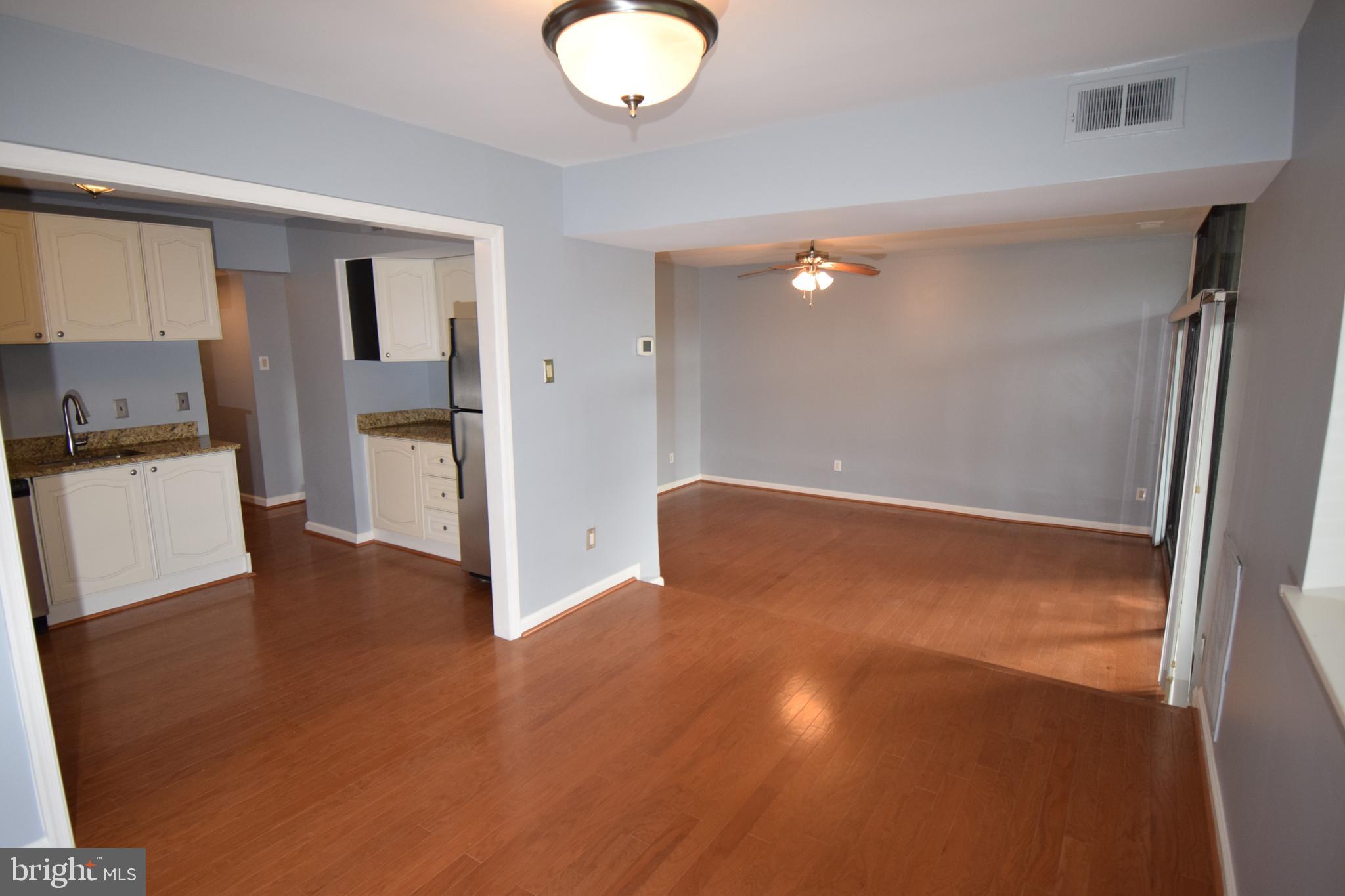 1641 Parkcrest Circle, Unit 101 Reston, VA 20190 - Photo 2 of 37 Dining room, kitchen and living room