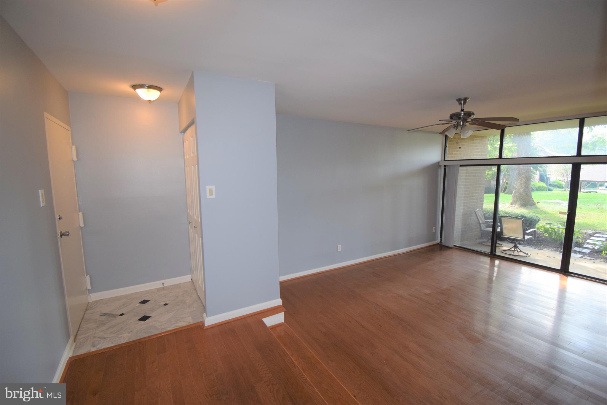 1641 Parkcrest Circle, Unit 101 Reston, VA 20190 - Photo 4 of 37 Foyer entry and Living Room