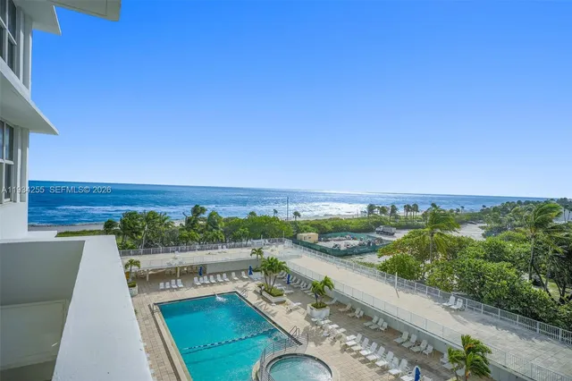 a view of swimming pool with a balcony