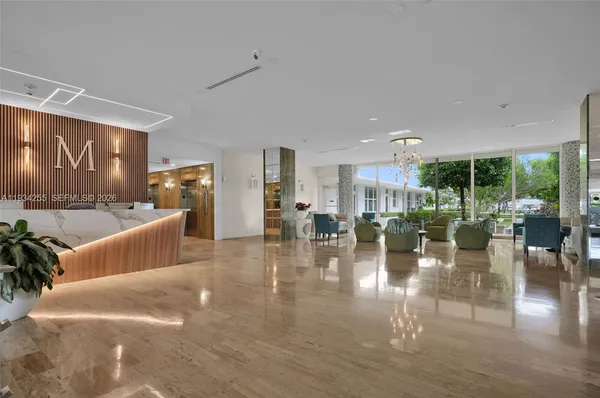 a living room with lots of furniture and a table