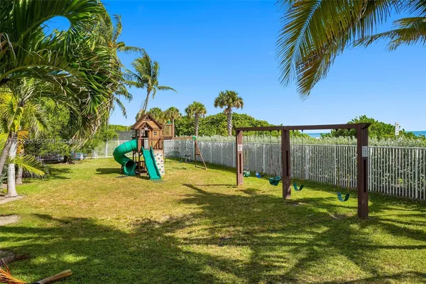 a view of a yard with a tree