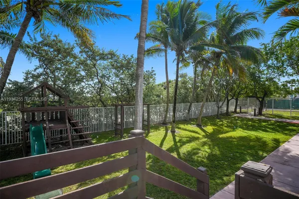 a view of a yard and ocean view