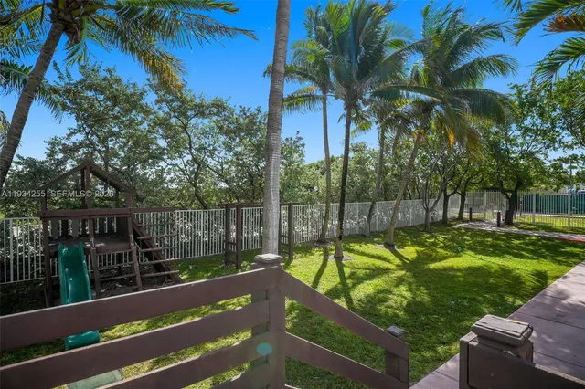 a view of a yard and ocean view
