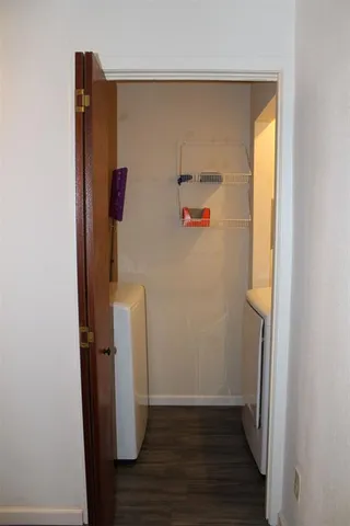 a view of an entryway with wooden floor