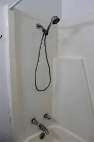 a bathroom with a sink and a window