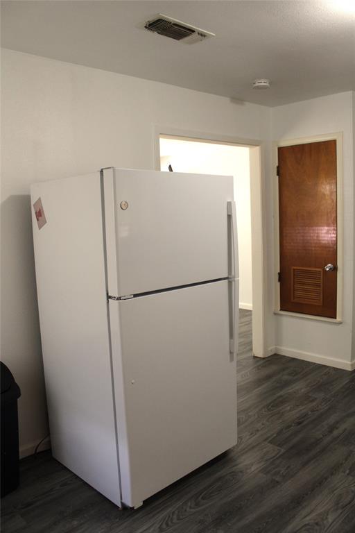 2506 Vincent Street Brownwood, TX 76801 - Photo 9 of 40 a white refrigerator freezer sitting in a kitchen