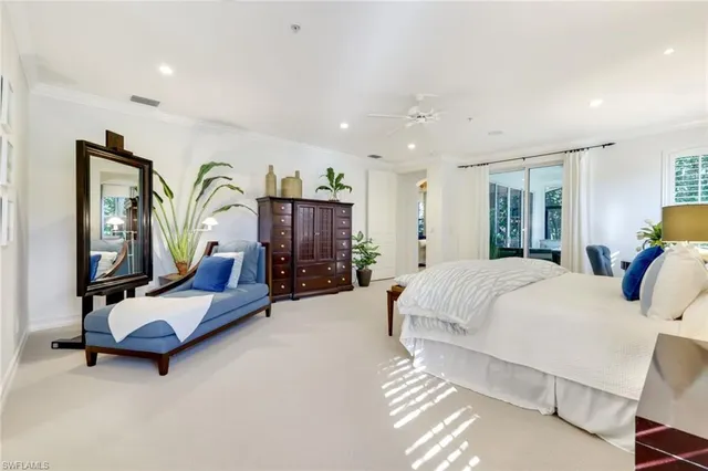 a bed room with furniture and gym equipment