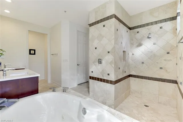 a bathroom with a bathtub and shower