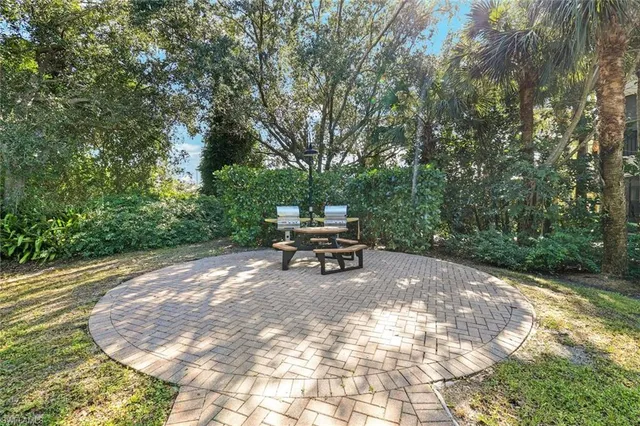 a bench sitting in middle of a yard
