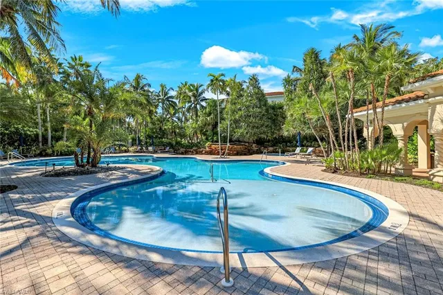 a view of a swimming pool with a sitting space