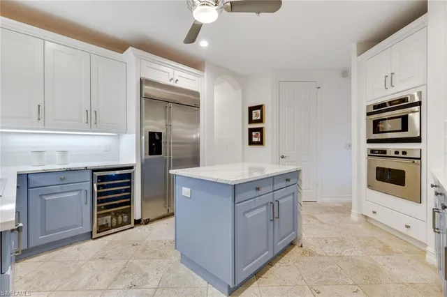 a kitchen with stainless steel appliances granite countertop a stove and a refrigerator