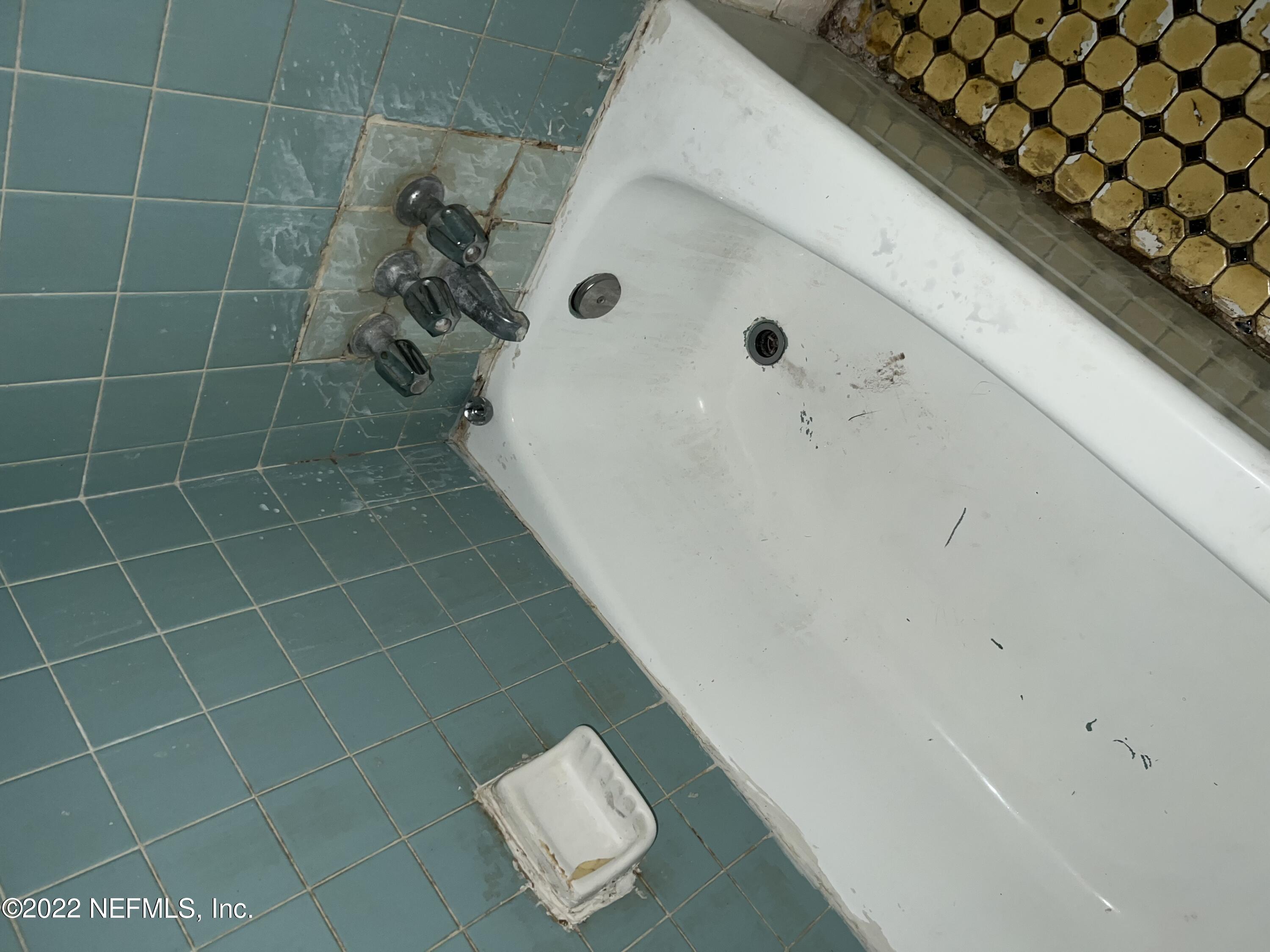 4423 Moncrief Road Jacksonville, FL 32209 - Photo 24 of 47 a bathroom with a bathtub and shower