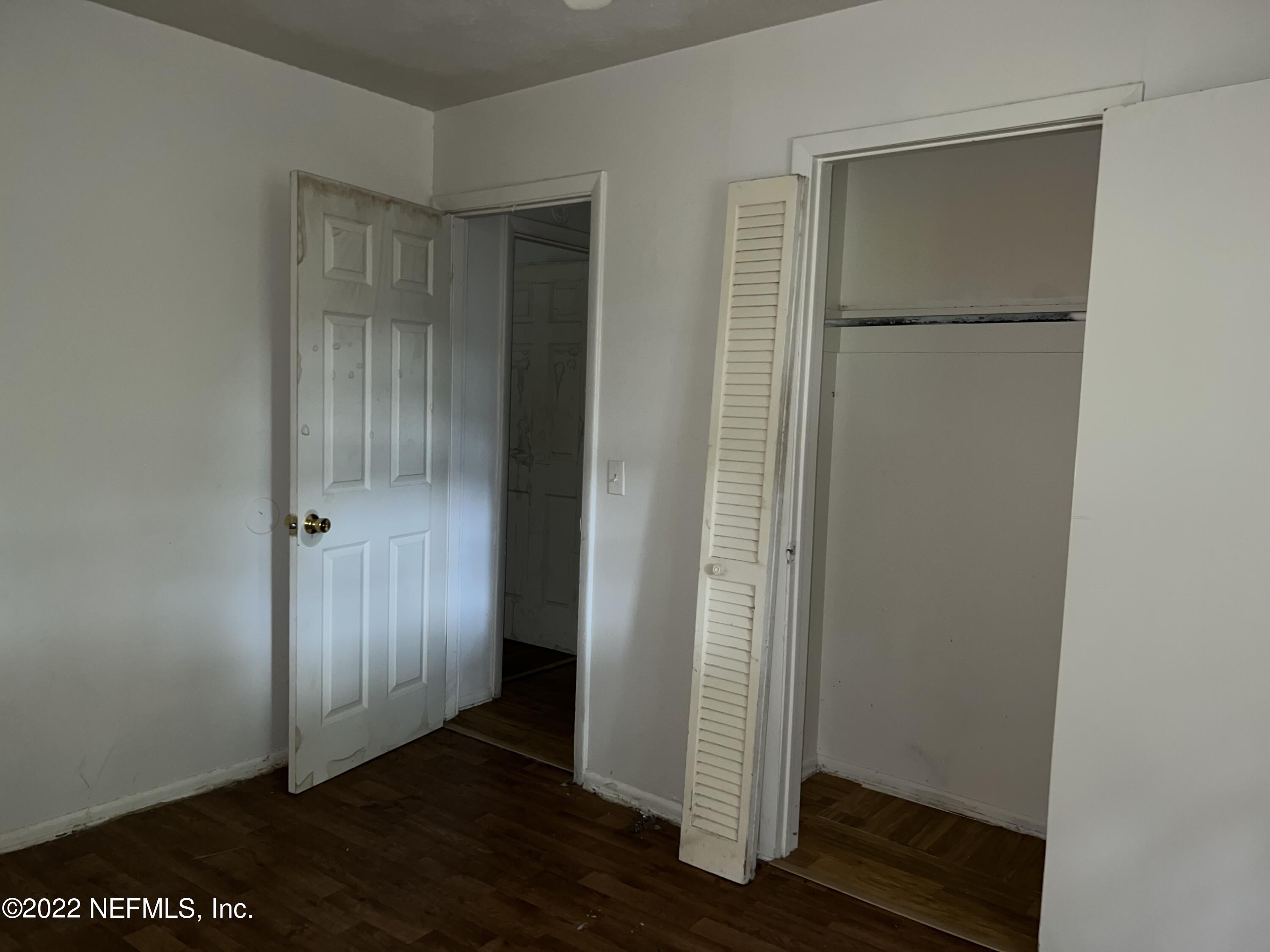 4423 Moncrief Road Jacksonville, FL 32209 - Photo 28 of 47 a view of an empty room with wooden floor