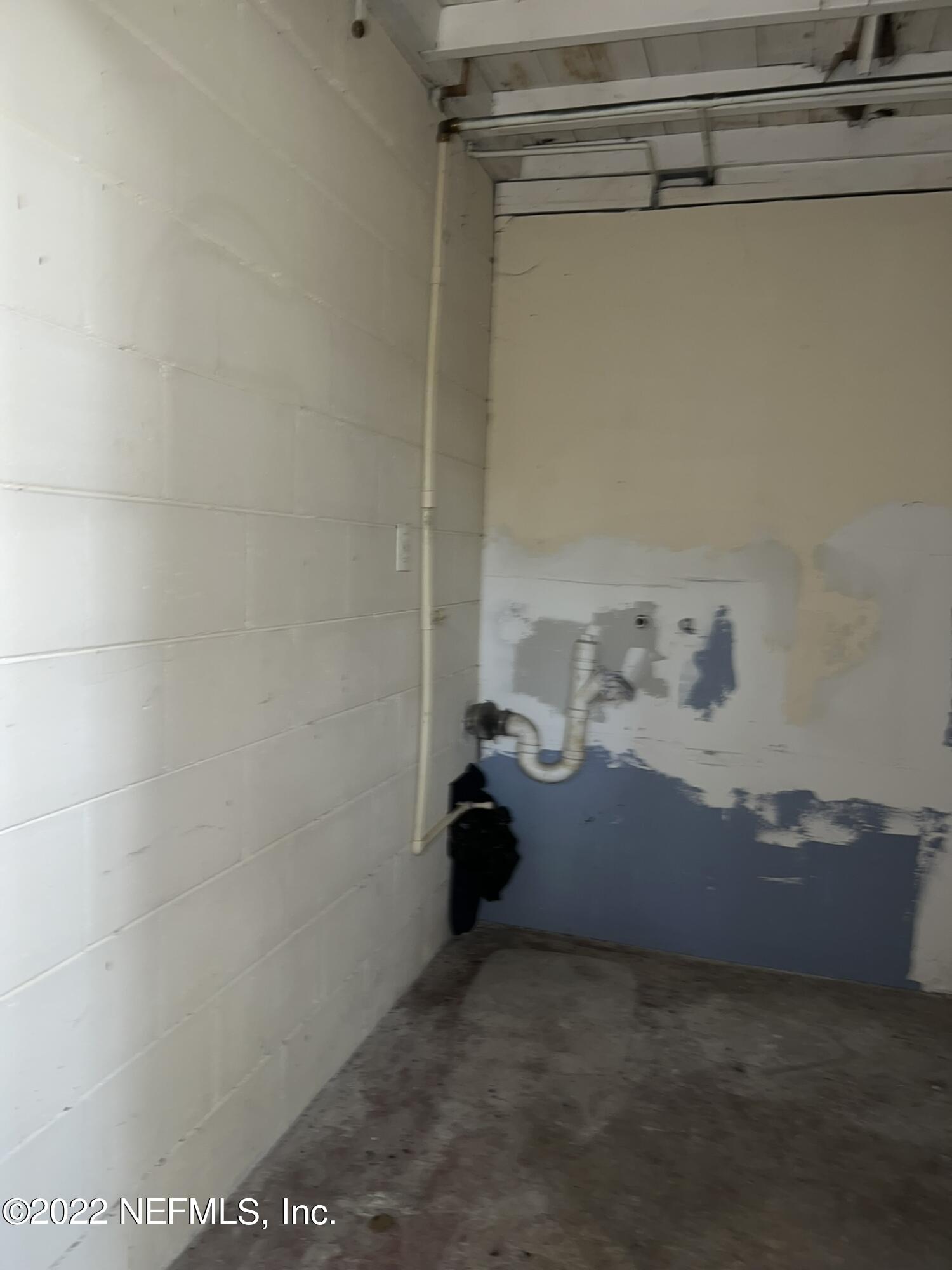 4423 Moncrief Road Jacksonville, FL 32209 - Photo 44 of 47 a view of storage and utility room with racks