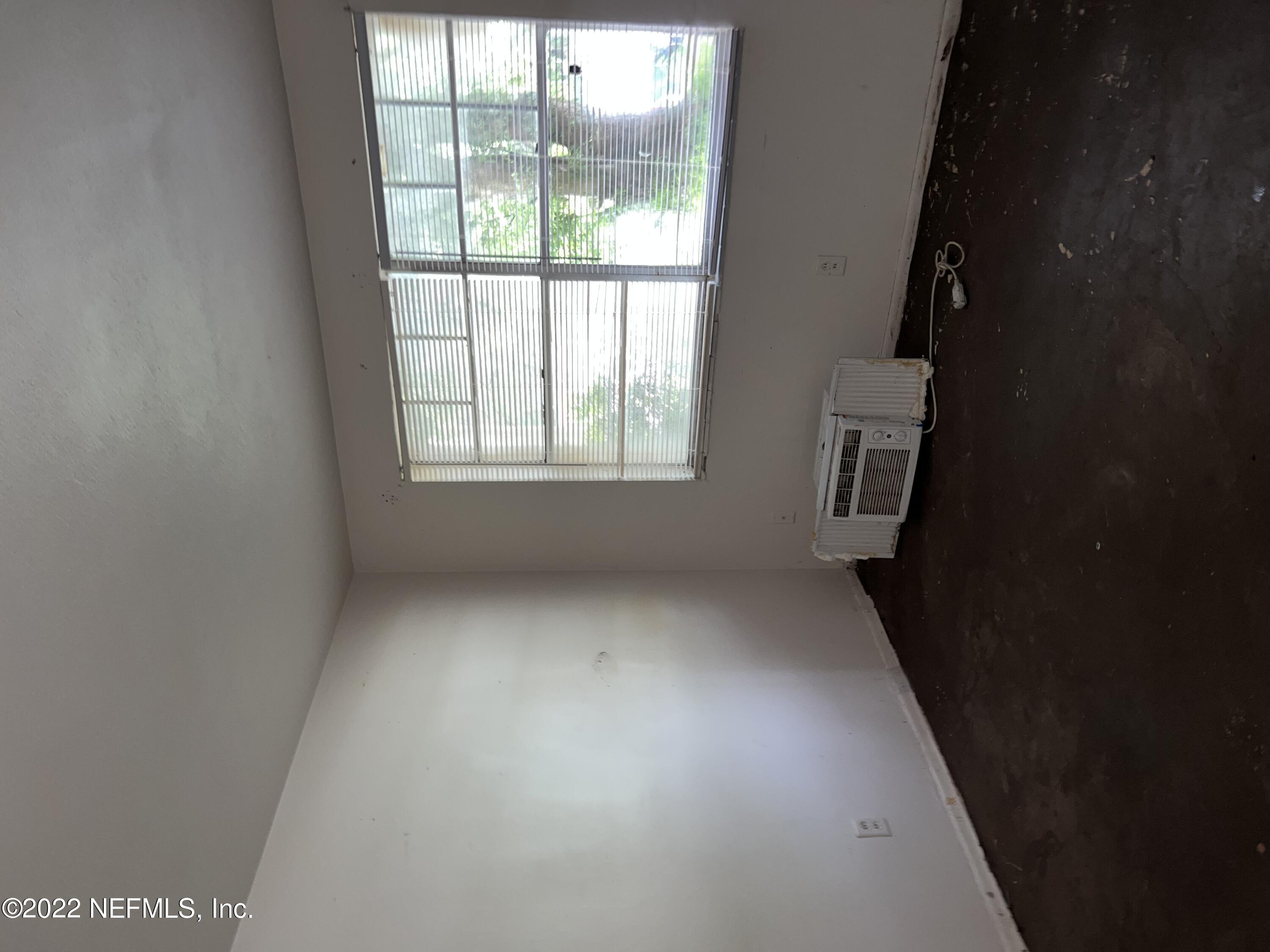 4423 Moncrief Road Jacksonville, FL 32209 - Photo 5 of 47 an empty room with a window