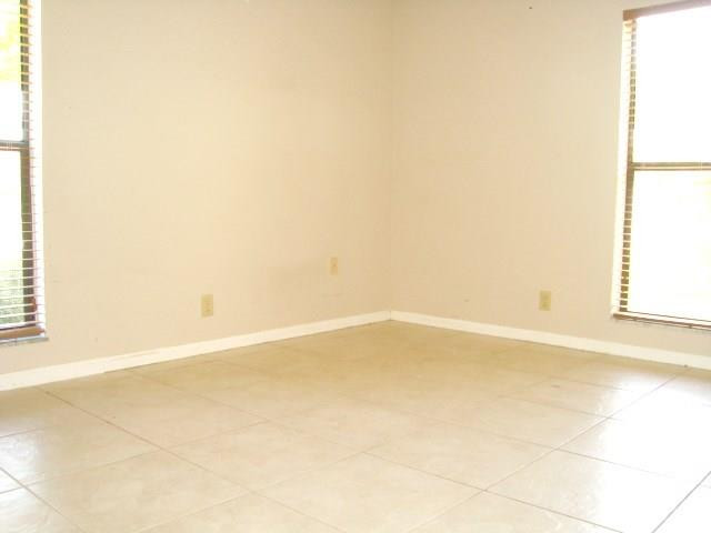 11460 Woodchuck Drive Boca Raton, FL 33428 - Photo 19 of 32 a view of an empty room with a window