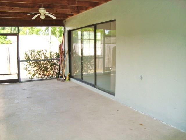 11460 Woodchuck Drive Boca Raton, FL 33428 - Photo 22 of 32 a view of a room with a porch