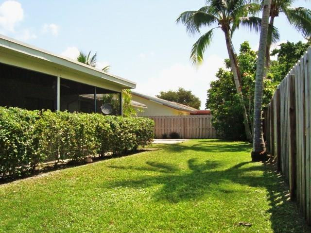 11460 Woodchuck Drive Boca Raton, FL 33428 - Photo 25 of 32 a backyard of a house with lots of green space