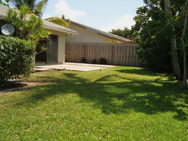 11460 Woodchuck Drive Boca Raton, FL 33428 - Photo 27 of 32 a swimming pool with outdoor seating and yard