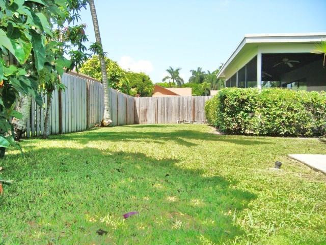11460 Woodchuck Drive Boca Raton, FL 33428 - Photo 31 of 32 a view of a house with backyard and garden
