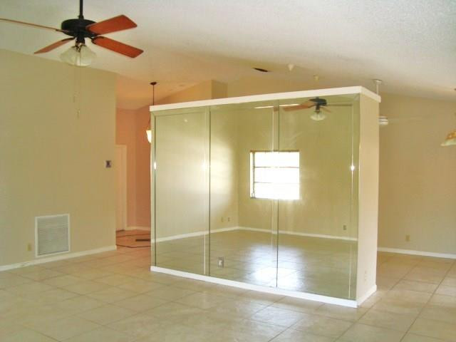 11460 Woodchuck Drive Boca Raton, FL 33428 - Photo 7 of 32 a bathroom with a shower and a glass door