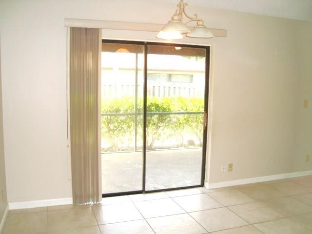 11460 Woodchuck Drive Boca Raton, FL 33428 - Photo 9 of 32 a view of an empty room with a window