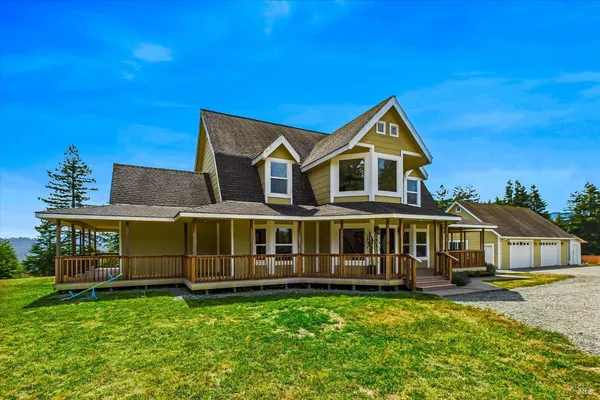 a living room with furniture flat screen tv and a large window