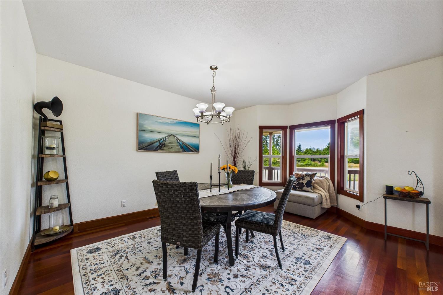 1150 Dinsmore Ranch Road Rio Dell, CA 95562 - Photo 20 of 71 a view of a dining room with furniture window and wooden floor